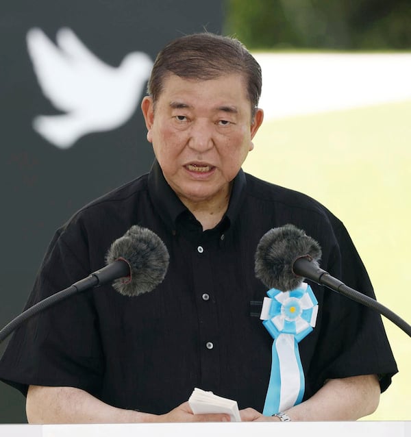 Japan's Prime Minister Shigeru Ishiba delivers a speech during a memorial ceremony at the Peace Memorial Park in Itoman, Okinawa, southern Japan Monday, June 23, 2025 as Japan marked the 80th anniversary of the end of the Battle of Okinawa. (Haruna Furuhashi/Kyodo News via AP)