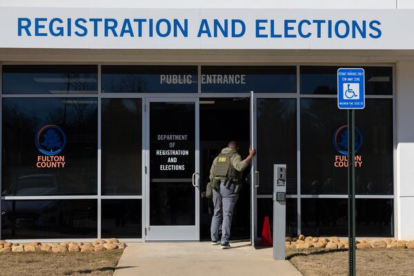 FBI agents enter the Fulton County Election Hub and Operation Center in Union City on Wednesday, Jan. 28, 2026. (Arvin Temkar/AJC)
