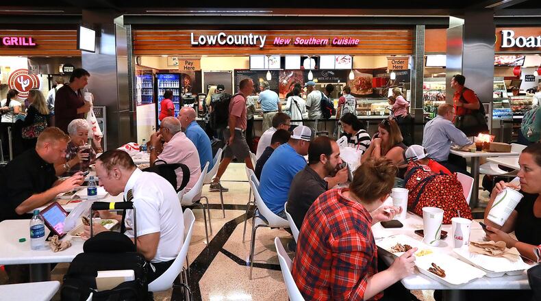 Travelers fill the dining area on Concourse A beside the Low Country restaurant at Hartsfield-Jackson International Airport on Sept 26, 2018, in Atlanta. (Curtis Compton/ccompton@ajc.com)