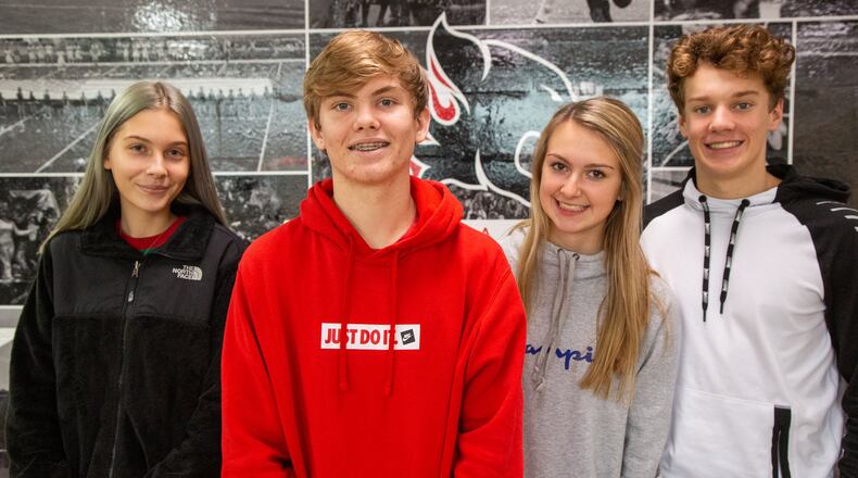 Anna Caputo (from left), Sutton Cadman, Gracie Chaves and Carson Hucks are part of the Alexander High School Habitat for Humanity chapter in Douglasville that is leading their community to raise $90,000 to build a home for a veteran. (Photo by Phil Skinner)