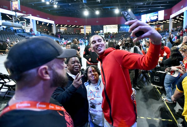 Dream center Brittney Griner takes a selfie with fans after a May 10 preseason game at Gateway Center Arena in College Park.