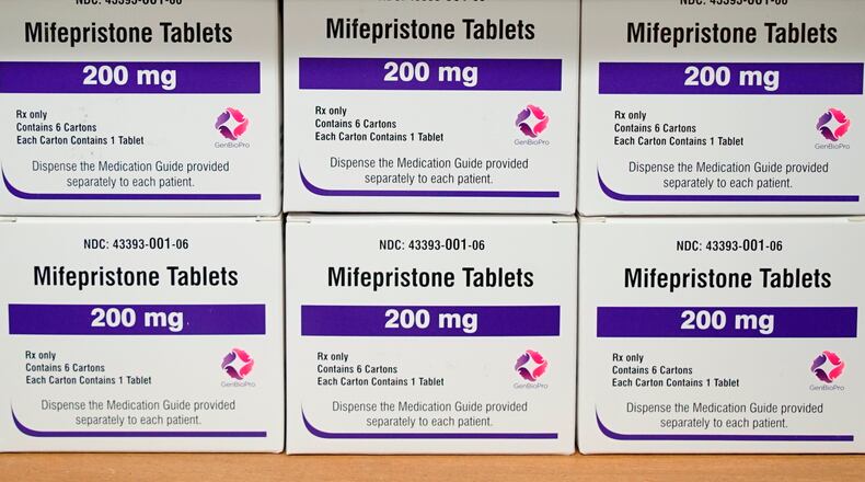 FILE - Boxes of the drug mifepristone sit on a shelf at the West Alabama Women's Center in Tuscaloosa, Ala., March 16, 2022. (AP Photo/Allen G. Breed, File)
