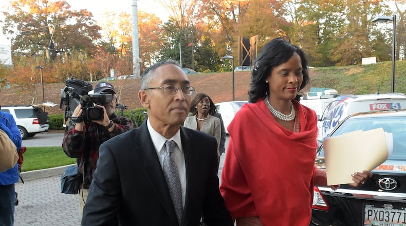 DeKalb CEO Burrell Ellis and his wife, Philippa, leave a press conference where he spoke Thursday for the first time since he was convicted a year and a half ago following a second trial in DeKalb County. The Georgia Supreme Court threw out Ellis’ guilty verdicts on Wednesday. KENT D. JOHNSON/kdjohnson@ajc.com