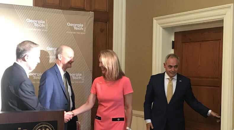 Beth Cabrera shakes hands with Georgia Board of Regents Chairman Don Waters after a press conference at Georgia Tech on June 14, 2019. Her husband, Angel Cabrera, right, was introduced as the incoming president of the school. University System of Georgia Chancellor Steve Wrigley, second from the left, spoke at the news conference about why Cabrera was hired. ERIC STIRGUS / ESTIRGUS@AJC.COM.