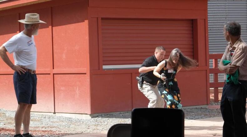 The arrest of Nydia Tisdale in 2014 at Burt's Pumpkin Farm/Brian K. Pritchard, Fetch Your News