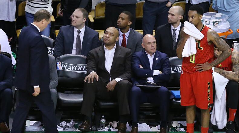 **** SECONDARY PHOTO **** 042416 BOSTON: Hawks head coach Mike Budenholzer (left) and guard Jeff Teague react to falling to the Celtics 104-95 in overtime in Game 4 of an NBA basketball first-round playoff series on Sunday, April 24, 2016, in Boston. The Celtics victory ties the series two games to two heading back to Atlanta for game five. Curtis Compton / ccompton@ajc.com