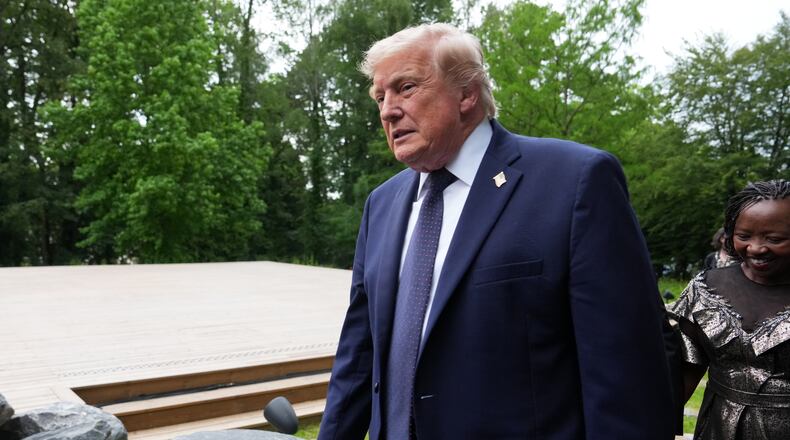 U.S. President Donald Trump walks away after a group photo of leaders at the G7 summit, Tuesday, June 16, 2026, in Evian-les-Bains, France. (AP Photo/Julia Demaree Nikhinson)
