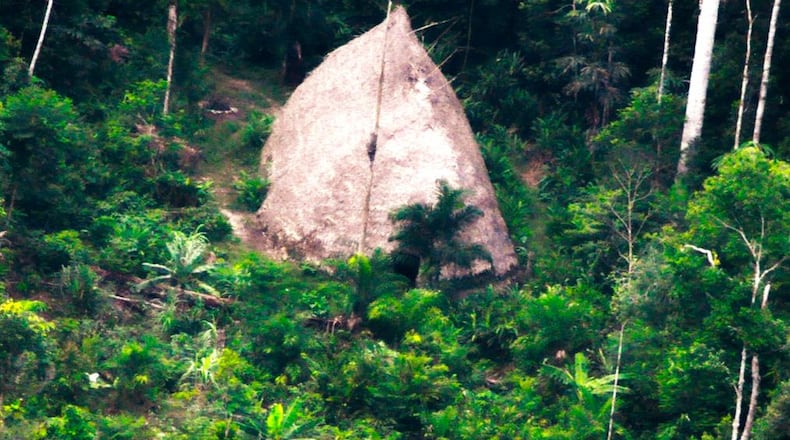This 2017 photo released by the National Indian Foundation (FUNAI) shows a "maloca," or long house, in Vale do Javari, Amazonas state, Brazil. Overall, the agency has registered 107 isolated tribes in Latin America's largest nation. While isolated communities are sometimes captured on video, Funai does not make contact with them.  (FUNAI via AP)