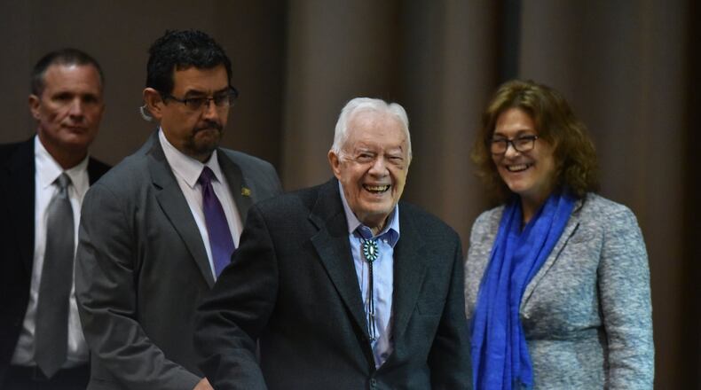 Former President Jimmy Carter with Karin Ryan, the Carter Center’s senior policy adviser for human rights, at this month’s 12th Human Rights Defenders Forum at the Carter Center on Tuesday, October 15, 2019. Carter has been walking with a cane since breaking his hip in May. On Monday, he fell and fractured his pelvis. (Hyosub Shin / Hyosub.Shin@ajc.com)