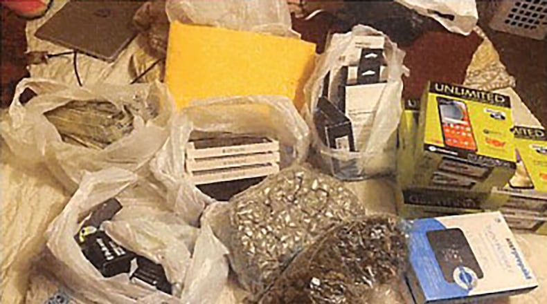 Alan Hall and Raane Onessimo are among 23 people charged in recent federal indictments with conspiring to smuggle drugs into Georgia prisons. This image was part of the federal indictments unsealed on Wednesday. Courtesy