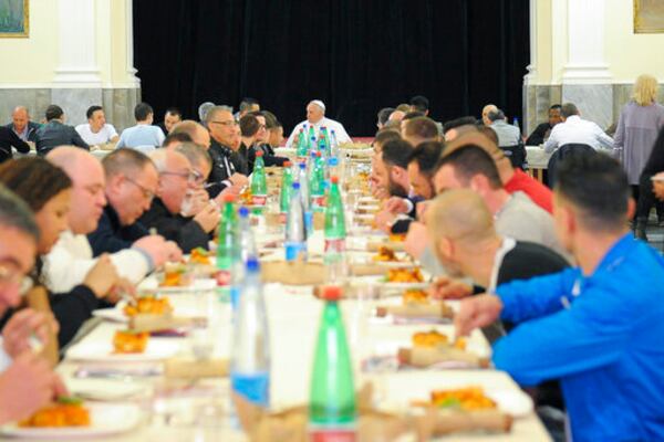 FILE - Pope Francis, center, eats with inmates in Naples' 'Poggioreale' prison, Italy, Saturday, March 21, 2015. (AP Photo/L'Osservatore Romano, Pool, File)