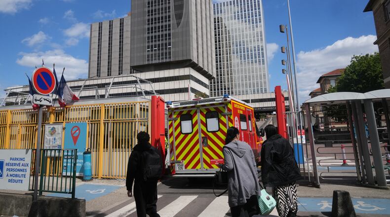 An ambulance enters the Bichat Hospital where a woman who tested positive for hantavirus remains in intensive care, in Paris, Tuesday, May 12, 2026. (AP Photo/Michel Euler)