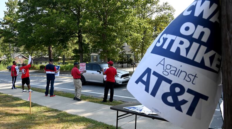 Striking AT&T workers hold signs outside AT&T facility on Brockett Road in Tucker on Aug. 30, 2024. The strike, which involved 17,000 workers in the region and 2,500 in metro Atlanta, ended Sunday, Sept. 15. (Hyosub Shin / AJC)