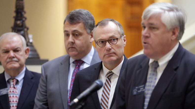 Lt. Gov. Casey Cagle (center right) looks on as he and Senate Majority Leader Bill Cowsert, R-Athens, right, and others announce the Senate’s 2017 legislative priorities at a press conference Thursday at the state Capitol. BOB ANDRES /BANDRES@AJC.COM