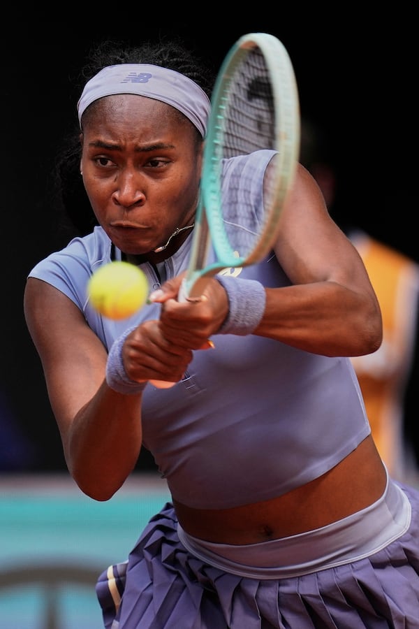 United States' Coco Gauff returns against Mirra Andreeva of Russia at the Madrid Open quarter-final tennis match in Madrid, Spain, Wednesday, April 30, 2025. (AP Photo/Manu Fernandez)