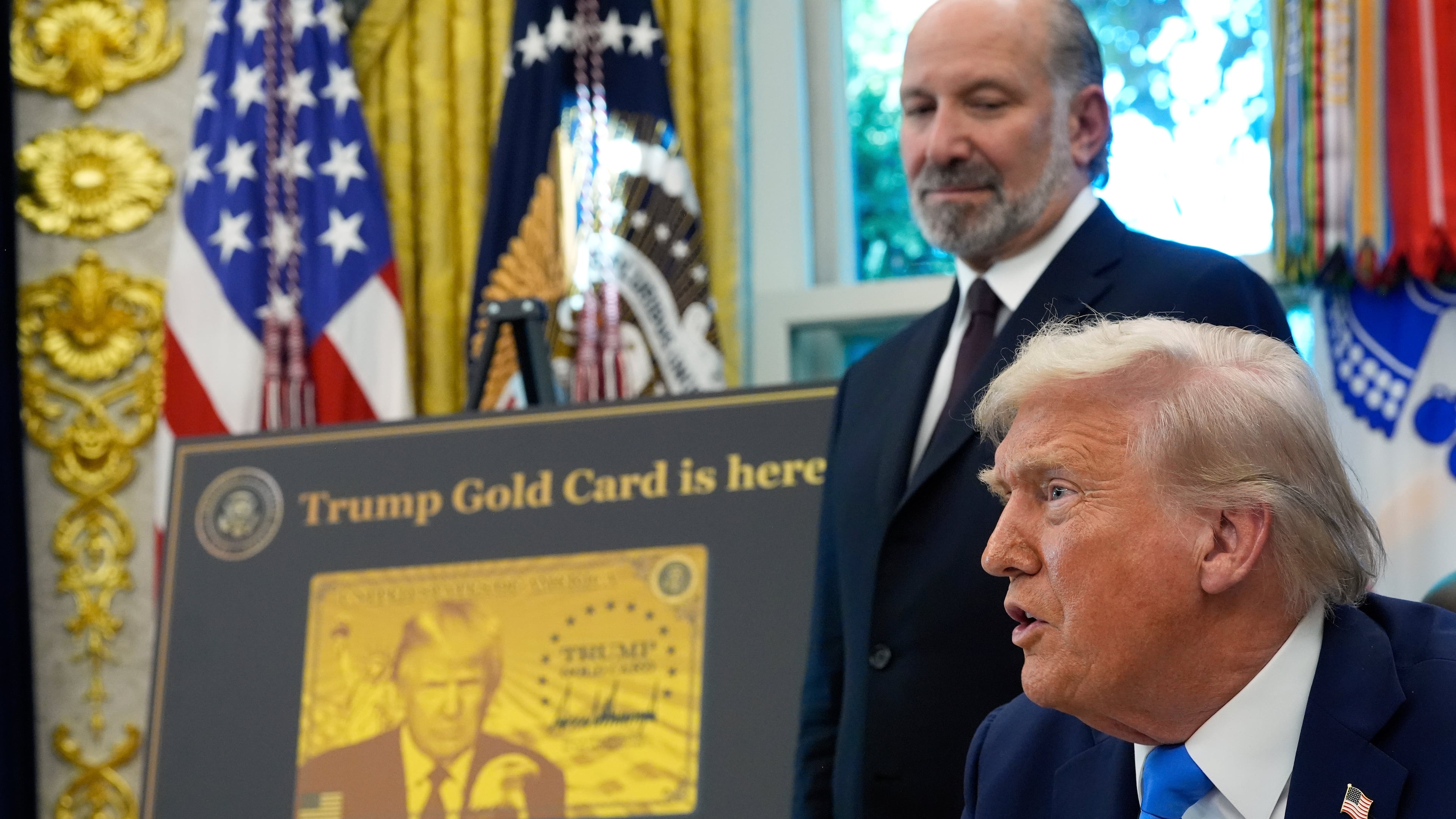 President Donald Trump speaks as Commerce Secretary Howard Lutnick listens in the Oval Office of the White House, Friday, Sept. 19, 2025, in Washington. (AP Photo/Alex Brandon)