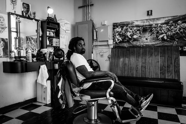 “Nate The Barber” posed in his chair at Pure Essence Barber Shop in Atlanta, GA. Photo by Antonio M. Johnson
Courtesy of Antonio M. Johnson