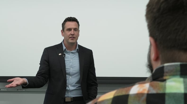 Zach Lahn, Republican candidate for Iowa governor, speaks to an environmental studies class at Drake University on Wednesday, May 6, 2026 in Des Moines, Iowa. (AP Photo/Brittany Peterson)