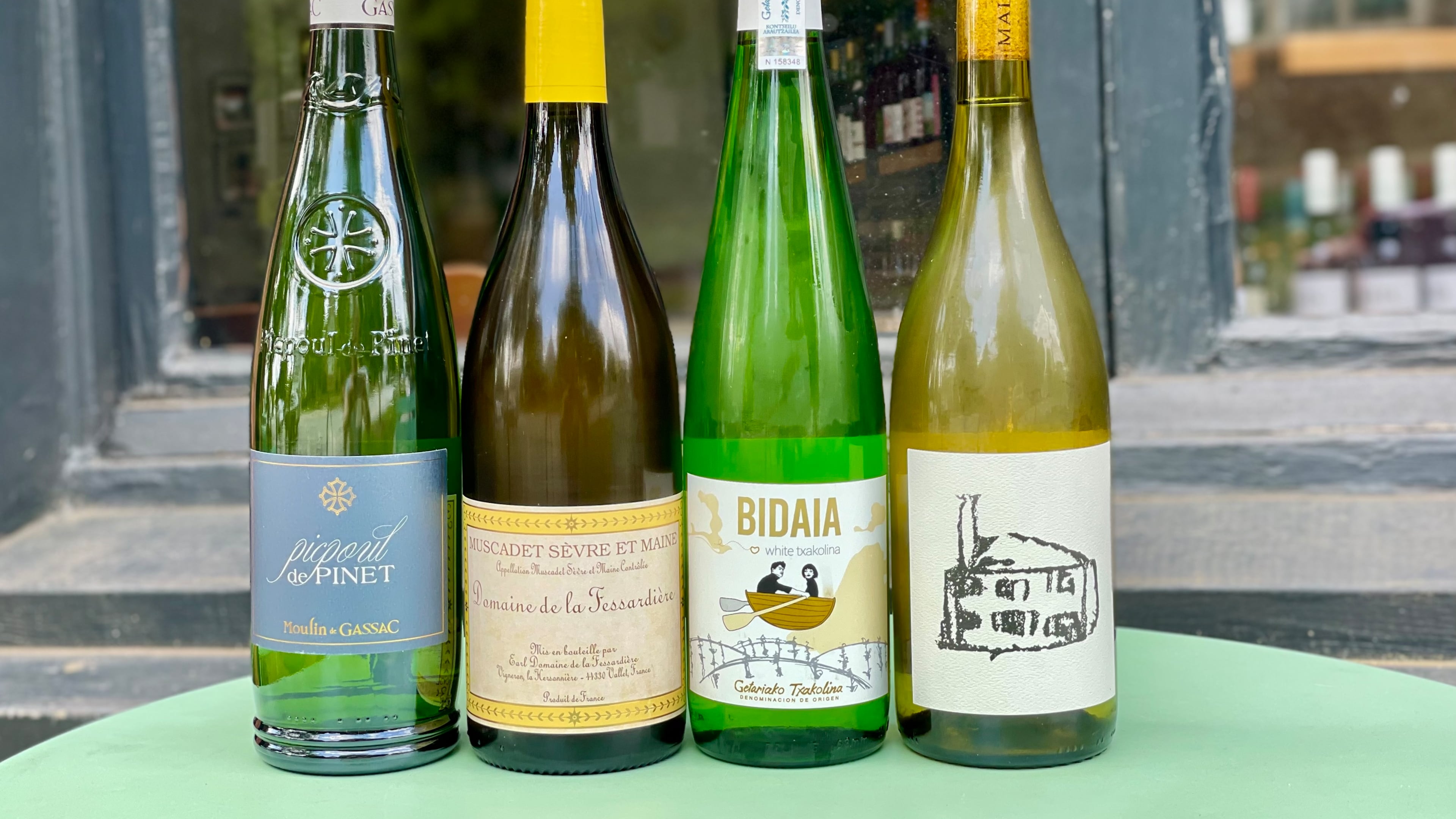 These crisp, salty white wines from coastal regions evoke beachy vibes. (Krista Slater for The Atlanta Journal-Constitution)