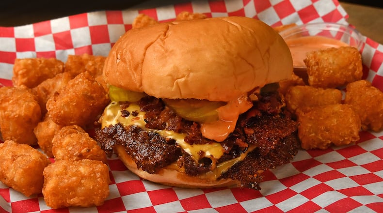 The critically acclaimed NFA Burger stand that founder Billy Kramer opened in a Dunwoody gas station in 2019 was among the vendor line-up at Truist Park Outfield Market. Kramer has since pulled out of the food hall to concentrate on the forthcoming opening of a brick-and-mortar location at Alpharetta's Avalon. (Chris Hunt for the AJC)