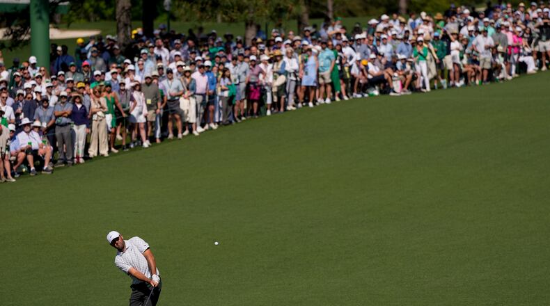 Scottie Scheffler chips to the green on the second hole during the second round of the Masters golf tournament at the Augusta National Golf Club, Friday, April 10, 2026, in Augusta, Ga. (AP Photo/David J. Phillip)