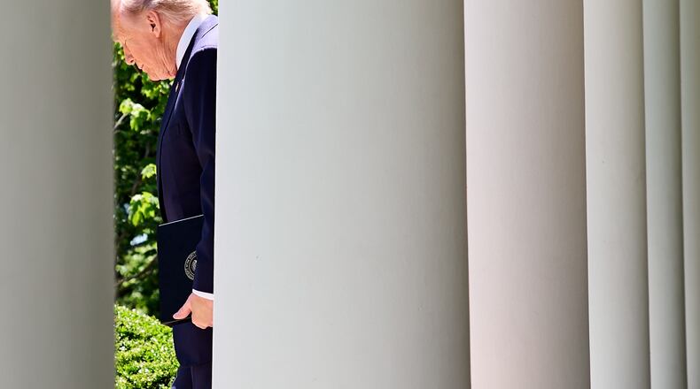 President Donald Trump walks through the Colonnade of the White House, as he arrives to attend a luncheon for mothers, Friday, May 8, 2026, in the Rose Garden of the White House, in Washington. (AP Photo/Jacquelyn Martin)
