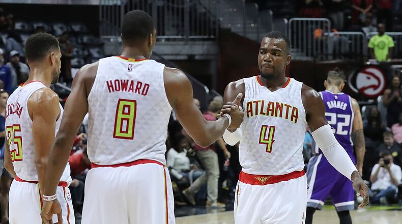Hawks’ Dwight Howard and Paul Millsap celebrate a 106-95 victory over the Kings in an NBA basketball game on Monday, Oct. 31, 2016, in Atlanta. Curtis Compton /ccompton@ajc.com