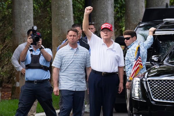 President Donald Trump gestures to supporters gathered for a Presidents Day rally as he leaves the Trump International Golf Club, Monday, Feb. 17, 2025, in West Palm Beach, Fla. (AP Photo/Ben Curtis)