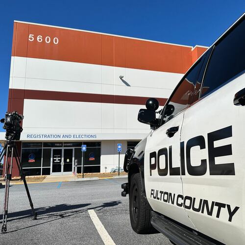 Police vehicles are seen outside the Fulton County elections hub in Union City, Ga., Wednesday, Jan. 28, 2026. (AP Photo/Emilie Megnien)