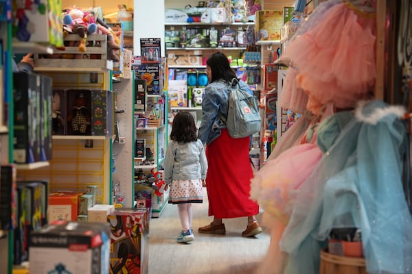 A family shops in a JaZams toy store Friday, June 27, 2025, in Princeton, N.J. (AP Photo/Matt Slocum)