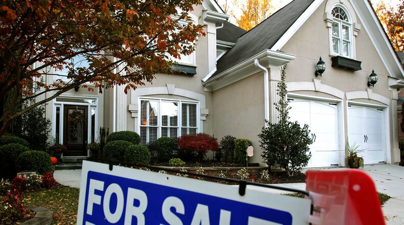 Home sales through the winter slowed more than usual in metro Atlanta, even though mortgage rates were coming down. Jason Getz jgetz@ajc.com