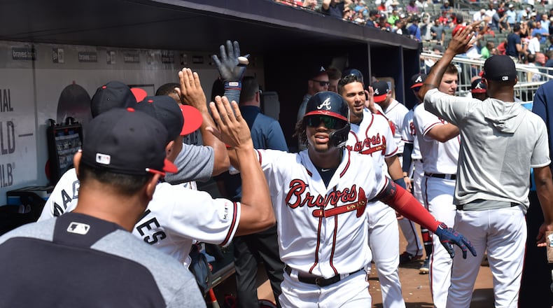 Ronald Acuna celebrates his two-run homer at SunTrust Park on Thursday.