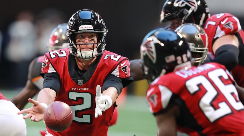 Atlanta Falcons quarterback Matt Ryan pitches to running back Tevin Coleman during the second half against Sunday, Oct 14, 2018, against the Tampa Bay Buccaneers at Mercedes-Benz Stadium in Atlanta.