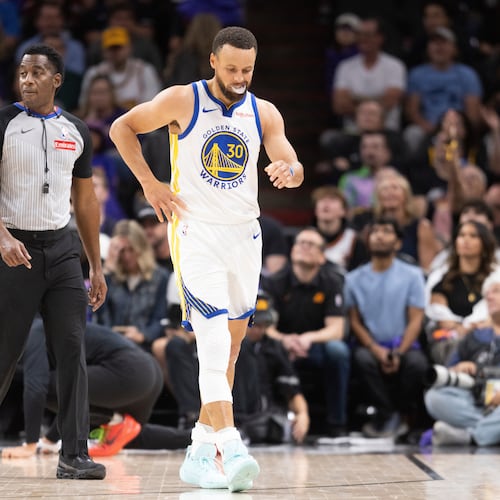 Golden State Warriors guard Stephen Curry (30) walks during the first half of his NBA play-in tournament game against the Phoenix Suns in Phoenix, Ariz., Friday, April 17, 2026. (Stephen Lam/San Francisco Chronicle via AP)