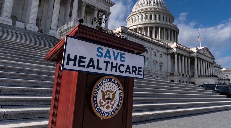 FILE - A lectern awaits the arrival of House Democrats to speak on the health care funding fight on the steps of the House at the Capitol in Washington, Nov. 12, 2025. (AP Photo/J. Scott Applewhite, File)