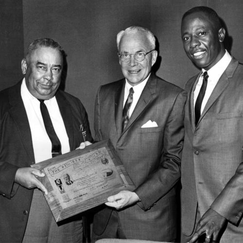 Mayor Ivan Allen Jr. (center) is presented with the Pioneer Award by the 100% Wrong Club and its president, Al Thompson (left), as Braves great Hank Aaron looks on. Allen ran for mayor of Atlanta on the promise he would bring big league sports to the city, guest columnist Bob Hope writes. (Bob Dendy/AJC 1967)