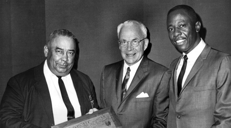 Mayor Ivan Allen Jr. (center) is presented with the Pioneer Award by the 100% Wrong Club and its president, Al Thompson (left), as Braves great Hank Aaron looks on. Allen ran for mayor of Atlanta on the promise he would bring big league sports to the city, guest columnist Bob Hope writes. (Bob Dendy/AJC 1967)