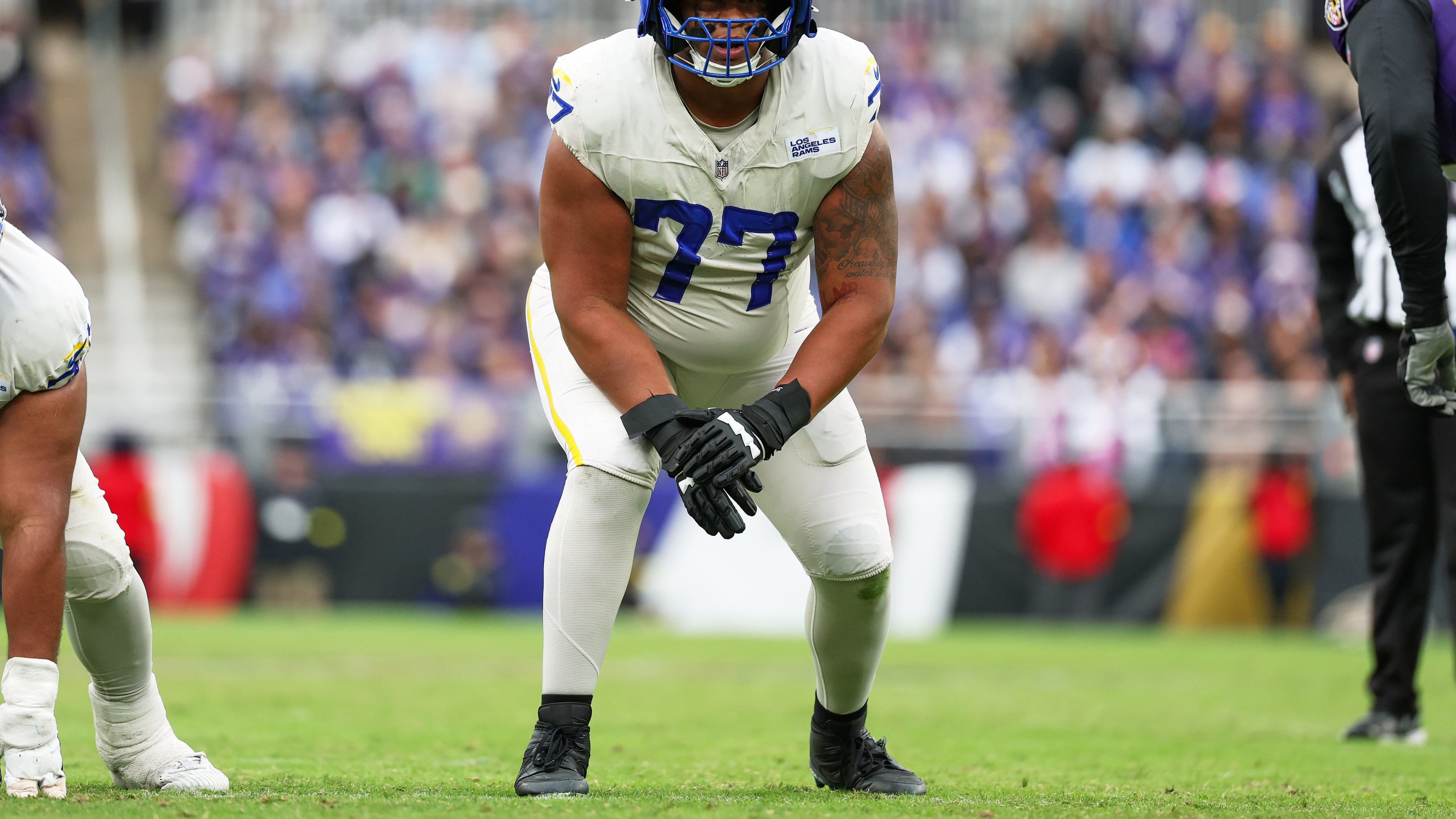 FILE - Los Angeles Rams offensive tackle Alaric Jackson (77) gets in position during the first half of an NFL football game against the Baltimore Ravens, Oct. 12, 2025, in Baltimore. (AP Photo/Terrance Williams, File)