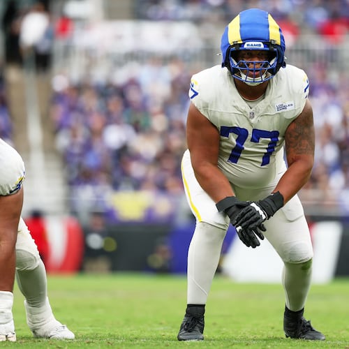 FILE - Los Angeles Rams offensive tackle Alaric Jackson (77) gets in position during the first half of an NFL football game against the Baltimore Ravens, Oct. 12, 2025, in Baltimore. (AP Photo/Terrance Williams, File)