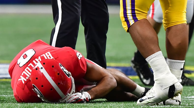 Georgia Bulldogs wide receiver Dominick Blaylock (8) is injured during the first half of the Georgia vs. LSU SEC Football Championship game at Mercedes-Benz Stadium in Atlanta. Hyosub Shin / hyosub.shin@ajc.com