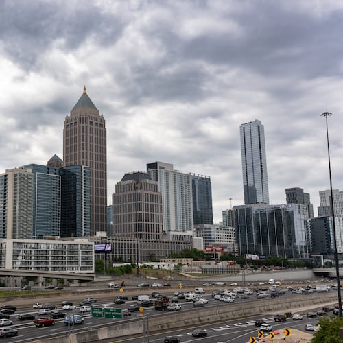 Rain clouds are expected to roll into Middle and North Georgia, as they did pictured here in Atlanta on May 6. The National Weather Service warns of “damaging winds, large hail, frequent lightning, and locally heavy rain" on Sunday afternoon and night. (Ben Hendren for the AJC)