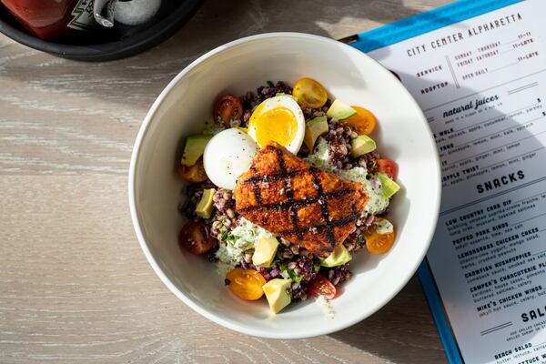 Lite Bowl with whole grains, purple yams, grilled salmon, tzatziki, tomato, 6 minute egg, avocado, and lemon-herb vinaigrette. Photo credit- Mia Yakel.
