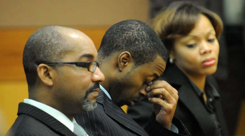Devonni Manuel Benton (center) reacts as Superior Court Judge T. Jackson Bedford addresses the jury during his trial in 2009. Benton was found guilty of murdering Jasmine Lynn and sentenced to life in prison. HYOSUB SHIN / HSHIN@AJC.COM