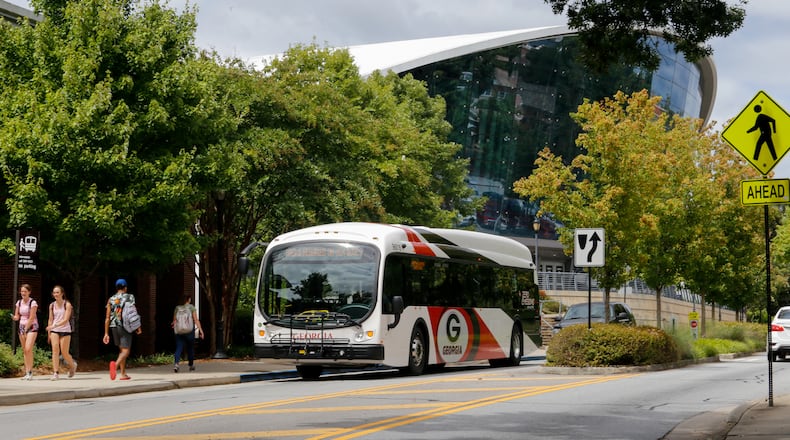The University of Georgia campus is divided between two state House districts along Carlton Street where Stegeman Coliseum is located.  The Coliseum is in one district where the bus stops, while across the street has a different representative. Wednesday, Sept 1, 2021.  (Jenni Girtman for The Atlanta Journal-Constitution)