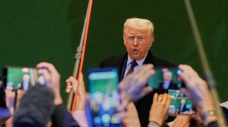 US President Donald Trump talks to media during the Annual Meeting of the World Economic Forum in Davos, Switzerland, Thursday, Jan. 22, 2026. (AP Photo/Markus Schreiber)