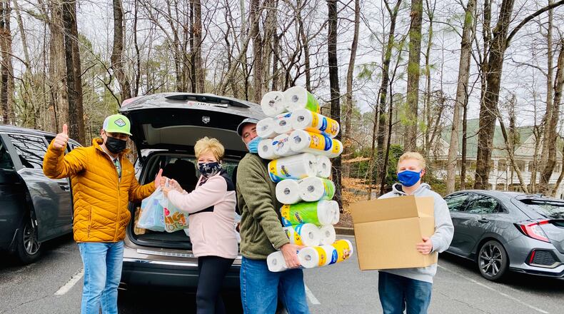 Residents of Kennesaw's Legacy Park community pitched in to restock the food pantry at the nearby Society of St. Vincent de Paul.