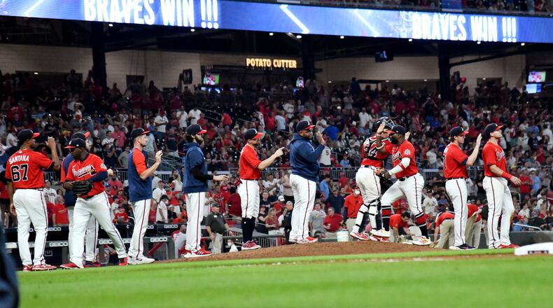 Braves players celebrate 9-1 victory over St. Louis Cardinals Friday, June 18, 2021, at Truist Park in Atlanta. (Hyosub Shin / Hyosub.Shin@ajc.com)