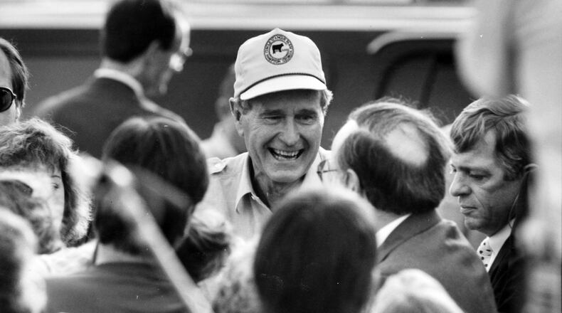 In this 1988 photo, George H.W. Bush visits the Circle G. Anous Ranch in Hampton, GA.