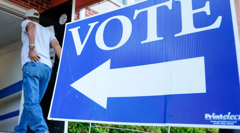 A person enters the Israel Baptist Church in Dekalb County to vote in the May 21 Georgia primary elections. (Miguel Martinez/The Atlanta Journal-Constitution)