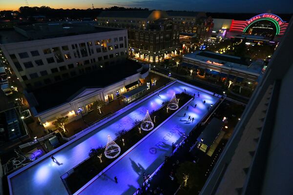 Skaters take to the ice at a 10,000-square-foot open-air ice skating rink in Atlantic Station on November 14, 2013 in Atlanta, Ga. Skate Atlantic Station is one of many ice skating rinks in metro Atlanta. Curtis Compton / AJC FILE